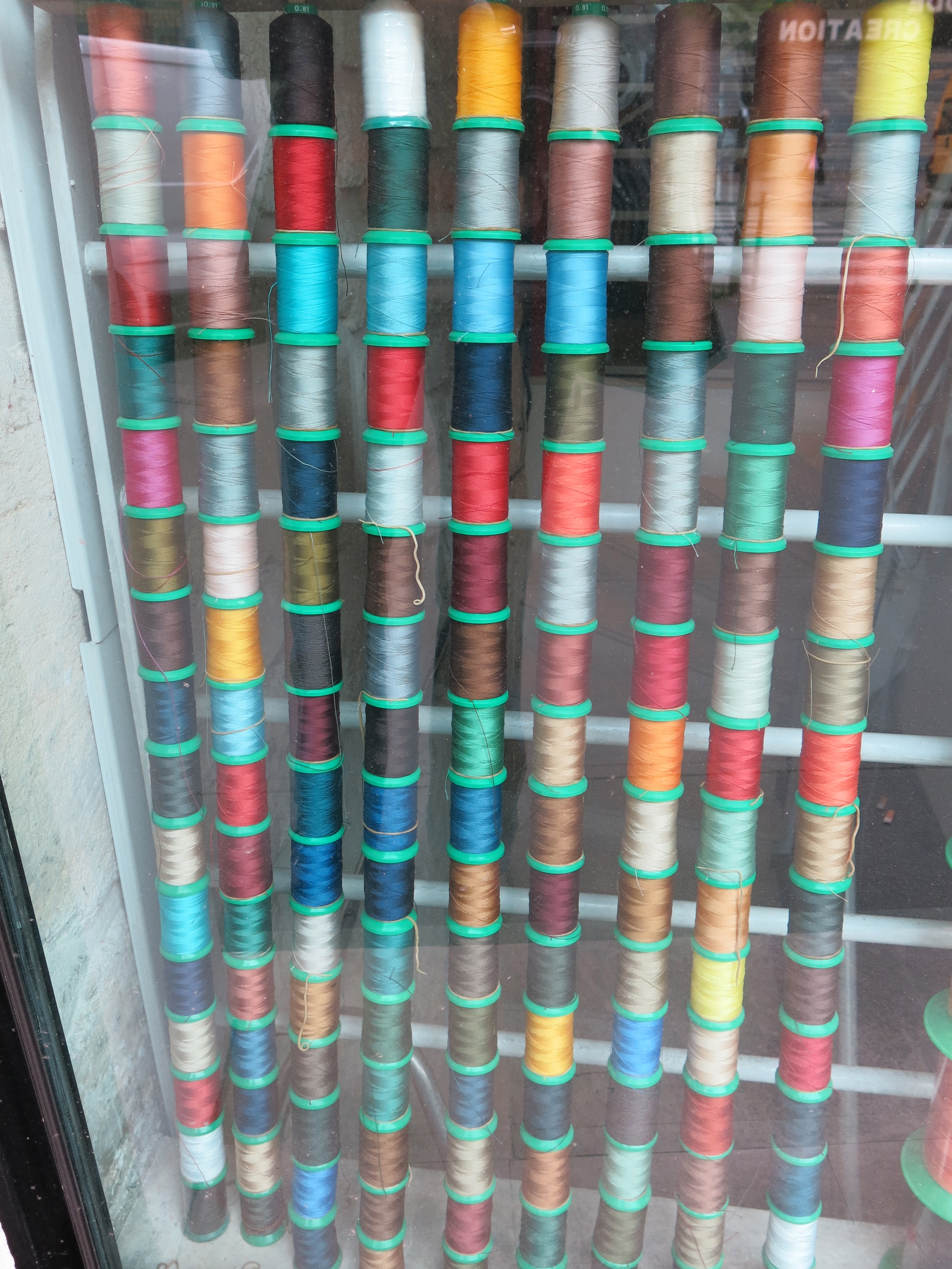 Somehow I love this collection of thread that was in the window of a tailoring shop